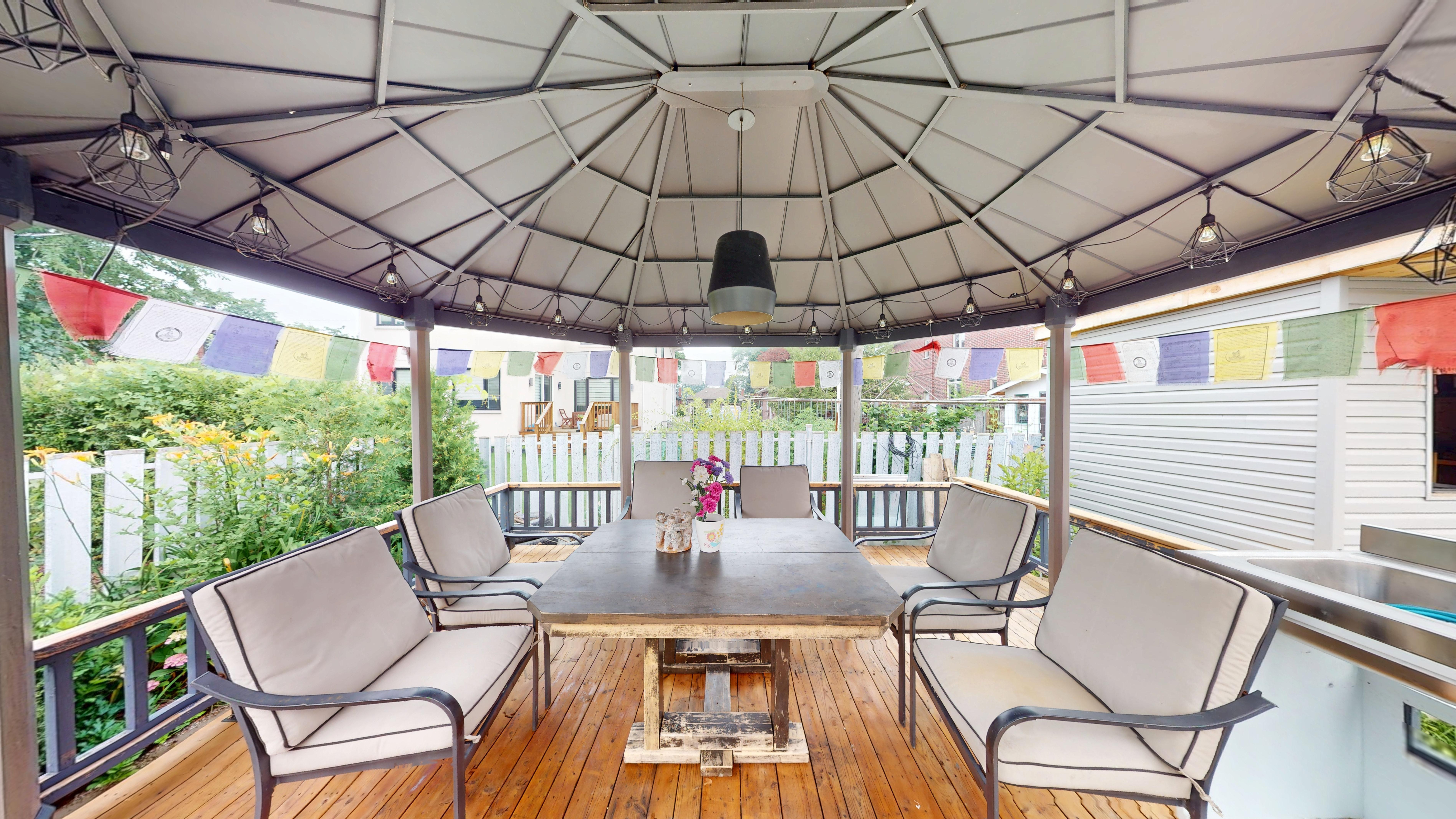 Back deck seating area under the covered gazebo