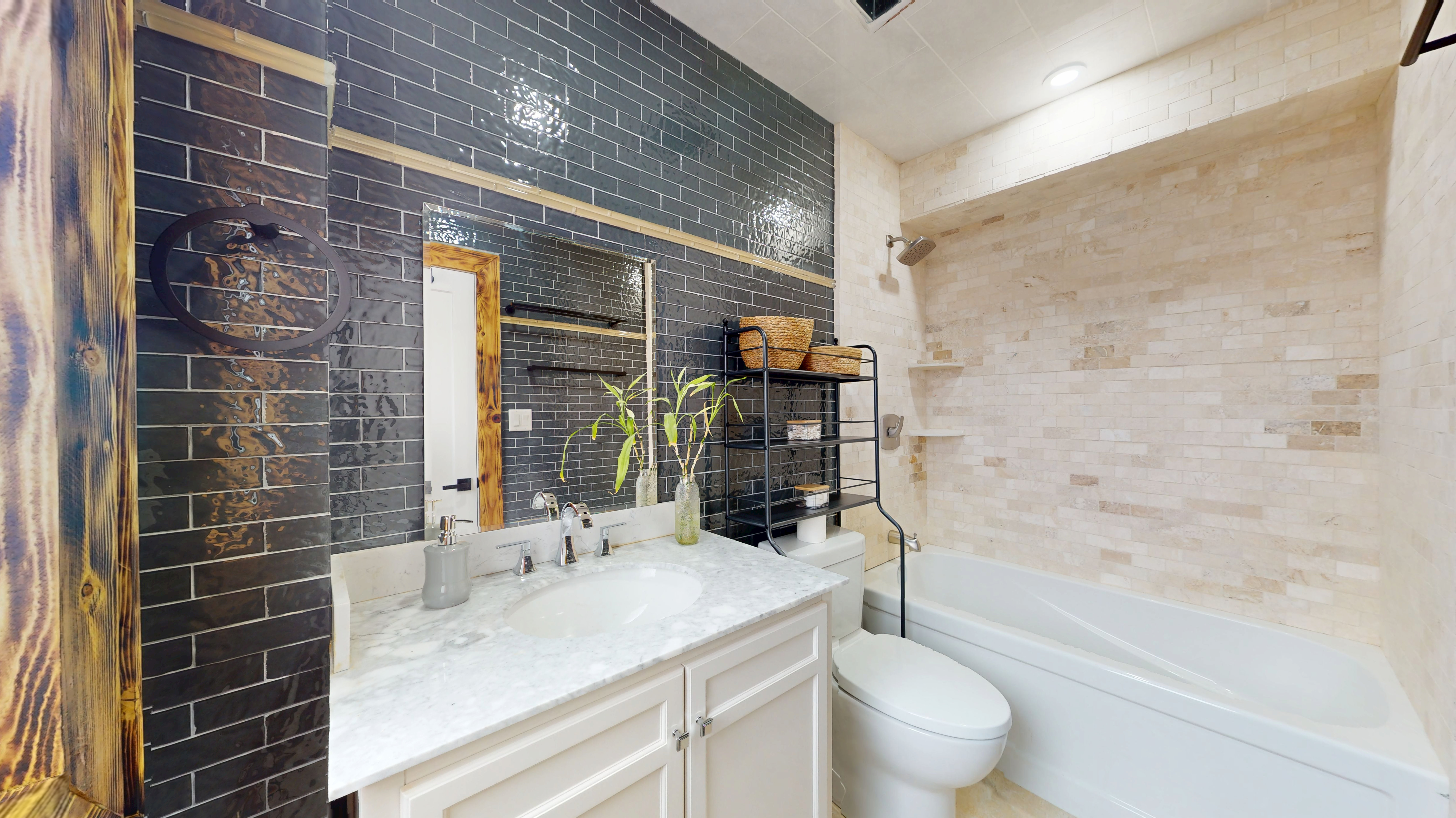 Bathroom with tiled shower and modern vanity